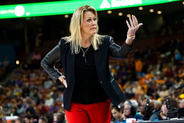 Georgia head coach Katie Abrahamson-Henderson looks to her bench in the first half of an NCAA college basketball game against LSU during the Southeastern Conference women's tournament in Greenville, S.C., Friday, March 3, 2023. (AP Photo/Mic Smith)