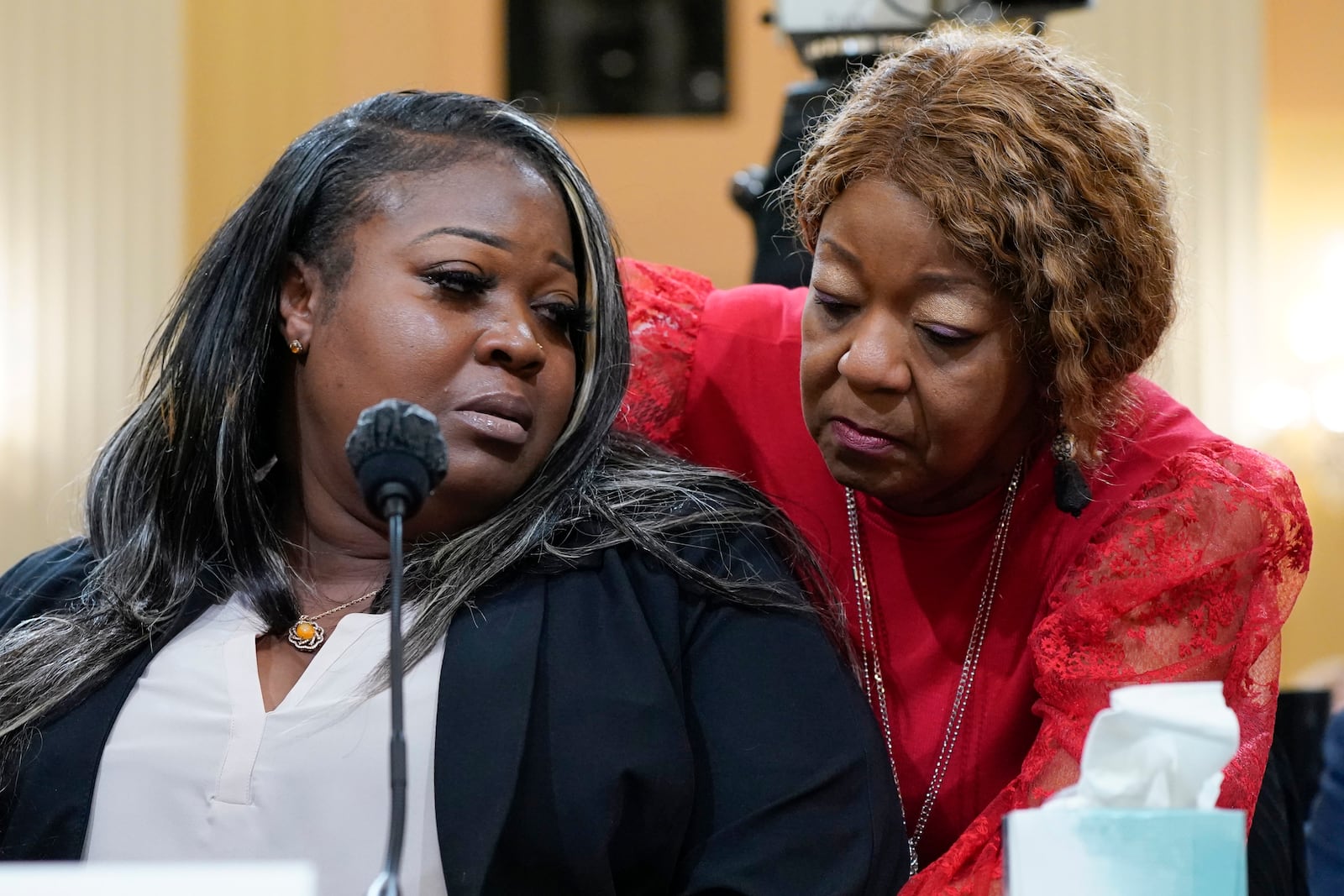 FILE - Wandrea "Shaye" Moss, a former Georgia election worker, is comforted by her mother Ruby Freeman, right, at a hearing of the House select committee investigating the Jan. 6 attack on the U.S. Capitol on Tuesday, June 21, 2022 (AP Photo/Jacquelyn Martin, File)