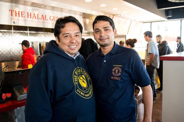  (From left to right) Halal Guys’ Juan Bustamante, director of training, and Moynul Chowdhury, franchisee in Chamblee. Photo credit- Mia Yakel.