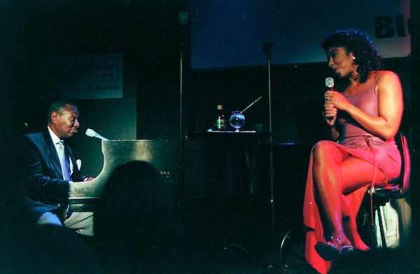 Natalie Cole performs with her uncle, Freddie Cole, on piano, at the Blue Note in New York, Feb. 2, 1999. Cole, a Grammy Award-winning singer whose hits included Inseparable, Pink Cadillac and Unforgettable, a virtual duet with her father, Nat King Cole, that topped the Billboard charts in 1991, died in Los Angeles on Dec. 31, 2015. She was 65. (Steve Berman/The New York Times)