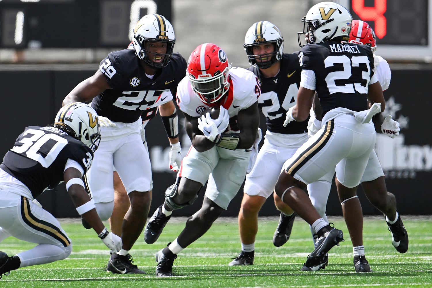 Georgia running back Daijun Edwards (30) runs against Vanderbilt during the first quarter of an NCAA football game, Saturday, Oct. 14, 2023, in Nashville, Tenn. (Special to the AJC/John Amis)