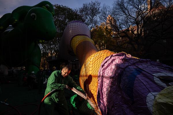 A person inflates a float in preparation for the Macy's Thanksgiving Day Parade, Wednesday, Nov. 27, 2024, in New York. (AP Photo/Yuki Iwamura)