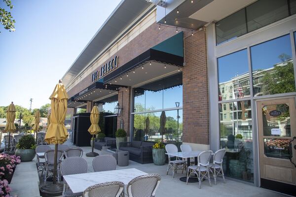 Outside the Select restaurant and bar in Sandy Springs, couches and tables on the patio have been separated so that guests can wait for their takeout orders at a social distance. ALYSSA POINTER / ALYSSA.POINTER@AJC.COM