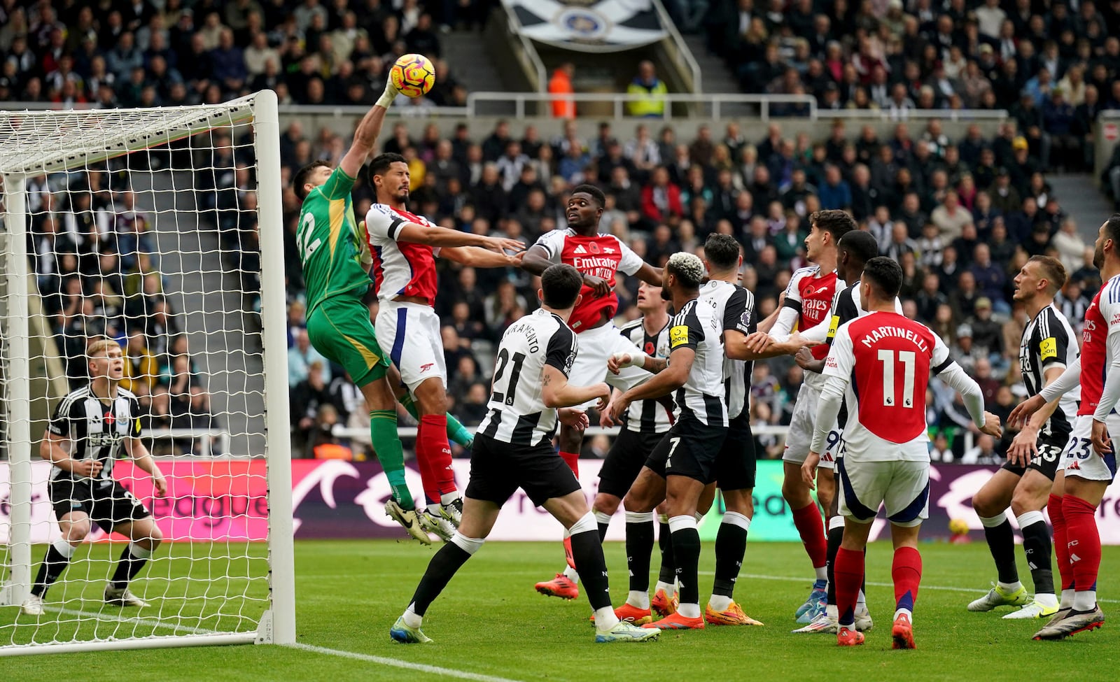 Newcastle United's goalkeeper Nick Pope clears the ball from a corner, during the English Premier League soccer match between Newcastle United and Arsenal, at St James' Park, in Newcastle, Saturday, Nov. 2, 2024. (Owen Humphreys/PA via AP)