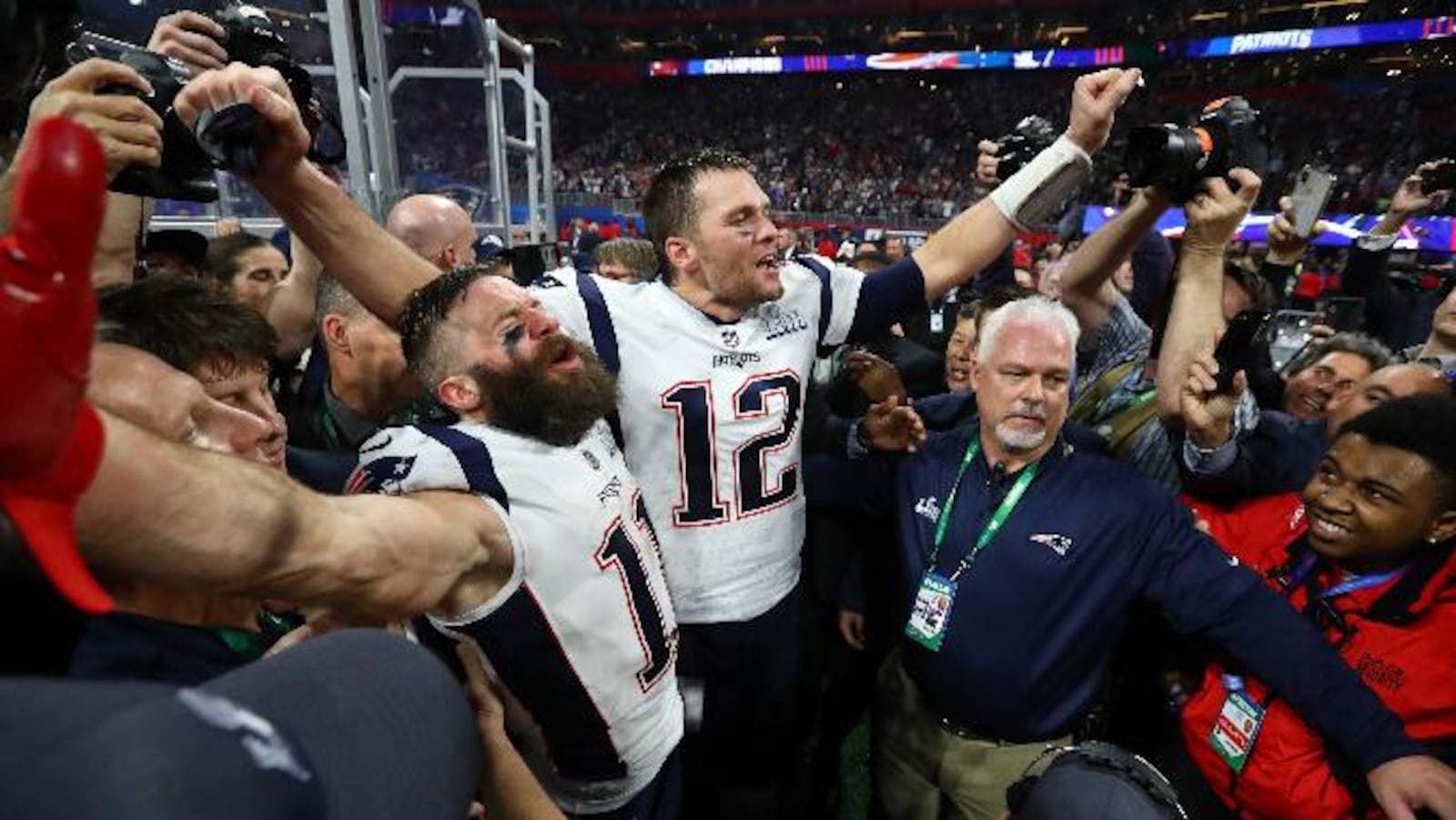 2/3/19 - Atlanta - New England Patriots wide receiver Julian Edelman (11) and New England Patriots quarterback Tom Brady (12) celebrate their 13-3 win against the Los Angeles Rams in Super Bowl LIII on Sunday, Feb. 3, 2019 at Mercedes-Benz Stadium in Atlanta, Ga.   &#xD;CURTIS COMPTON / CCOMPTON@AJC.COM