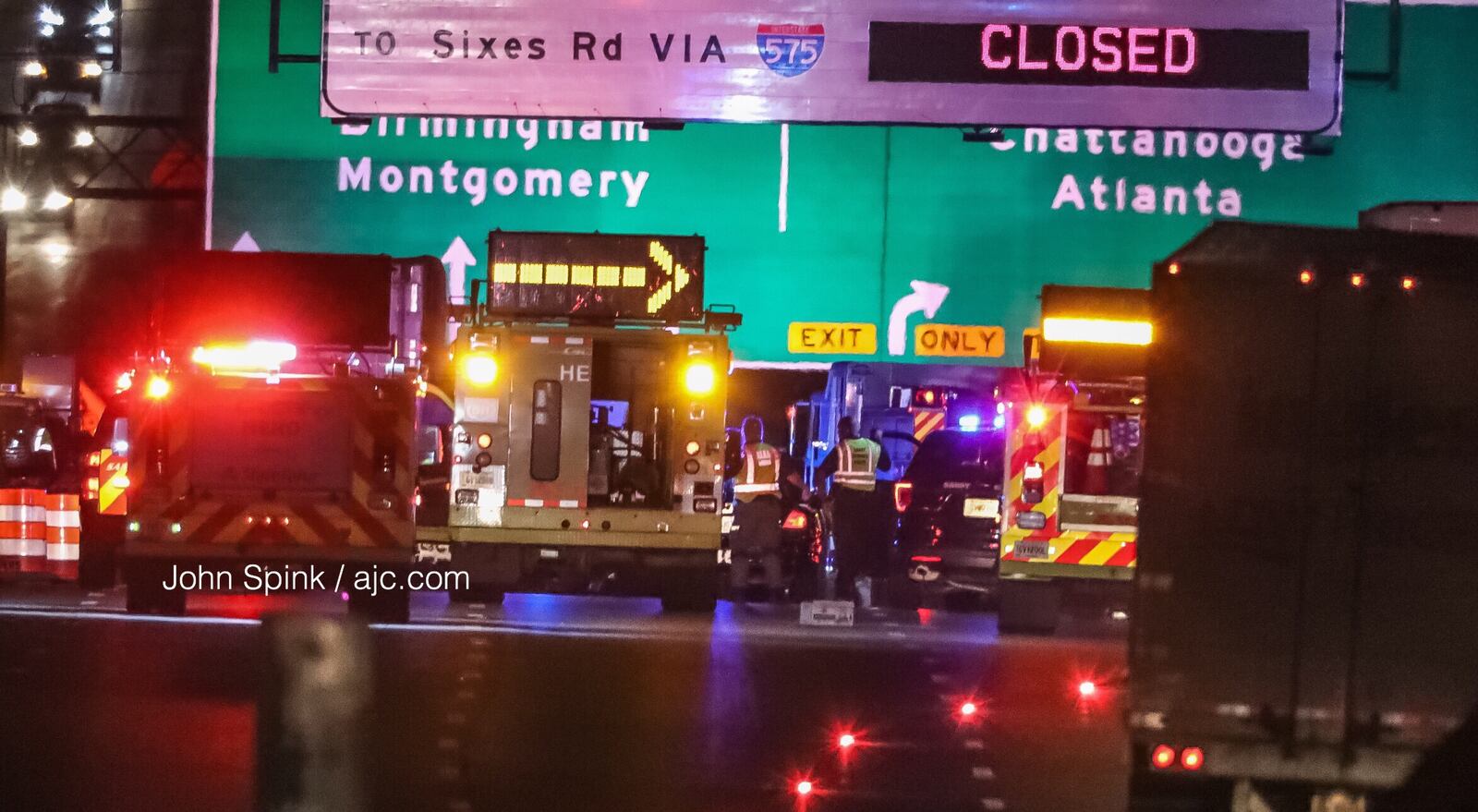 Morning commute traffic slows at I-285 West before the Chattahoochee River where police have responded to a fatal crash. JOHN SPINK / JSPINK@AJC.COM