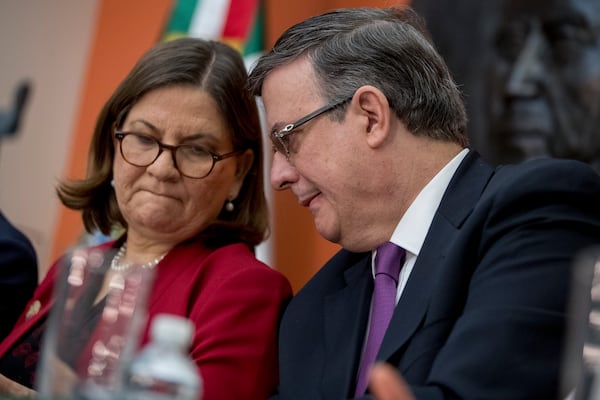 FILE - Mexican Ambassador Martha Barcena, left, and Foreign Affairs Minister Marcelo Ebrard attend a news conference at the Mexican Embassy in Washington, June 3, 2019, as part of a Mexican delegation in Washington for talks following trade tariff threats from the Trump Administration. (AP Photo/Andrew Harnik, File)