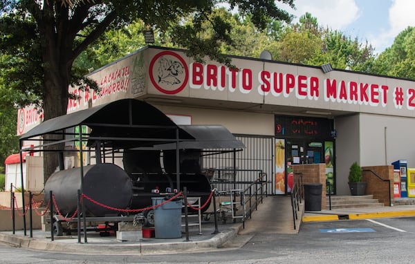 The two large grills outside Brito Supermarket are constantly in use on the weekends. CONTRIBUTED BY HENRI HOLLIS