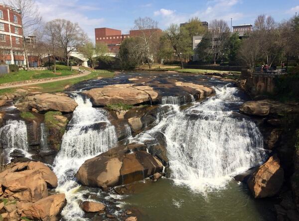 Kids love exploring Falls Park on the Reedy River in Greenville, SC.