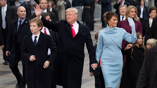 WASHINGTON, DC - JANUARY 20:   President Donald Trump and first lady Melania Trump, along with their son Barron, walk in their inaugural parade on January 20, 2017 in Washington, DC.  Donald Trump was sworn-in as the 45th President of the United States. (Photo by Kevin Dietsch - Pool/Getty Images)