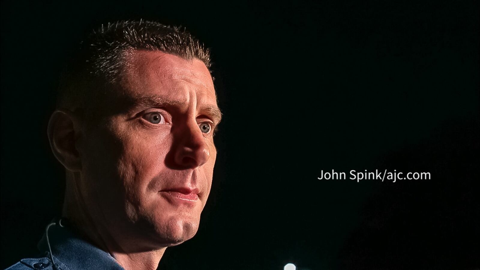 Gwinnett County police Cpl. Collin Flynn speaks with reporters at police headquarters Friday morning after a man was shot and killed on I-85.