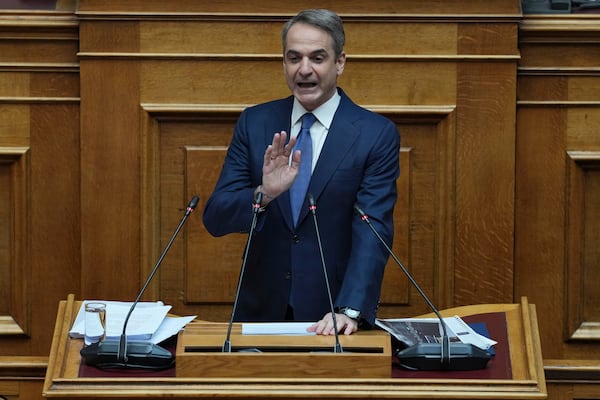 Greek Prime Minister Kyriakos Mitsotakis speaks in parliament ahead of the submission of a no-confidence motion by opposition parties over the government's handling of Greece's worst rail disaster two year ago, in Athens, Wednesday, March 5, 2025. (AP Photo/Thanassis Stavrakis)