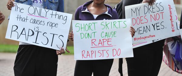 Students at Agnes Scott College show their support for sexual assault victims as part of a national day of action, Carry That Weight, last fall. Georgia colleges are struggling to create campus tribunals that respect victims and are fair to the accused. BRANT SANDERLIN / BSANDERLIN@AJC.COM