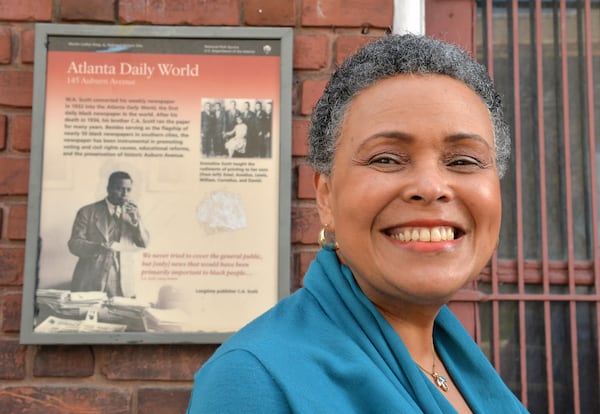 Alexis Scott stands outside the old abandoned Atlanta Daily World building on Auburn Avenue in Atlanta in March 2014. The newspaaer was sold in 2012  to out-of-town interests by the founding Scott family. HYOSUB SHIN / HSHIN@AJC.COM