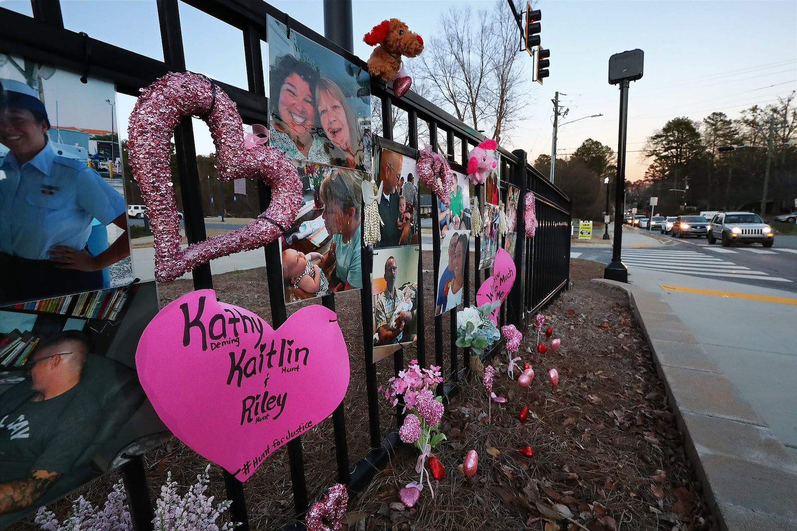 A memorial for Kaitlin Hunt and her infant, Riley, and family friend Kathy Deming near the collision site. Curtis Compton/ccompton@ajc.com