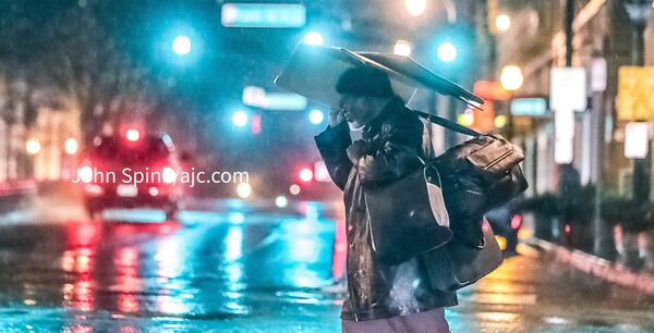 Rain comes down on Marietta Street in downtown Atlanta as a series of thunderstorms moves through North Georgia on Tuesday morning.