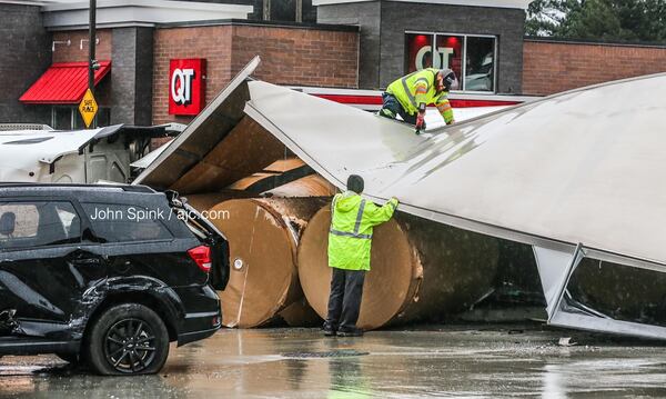 The tractor-trailer was hauling nine rolls of paper weighing about 5,500 pounds each.