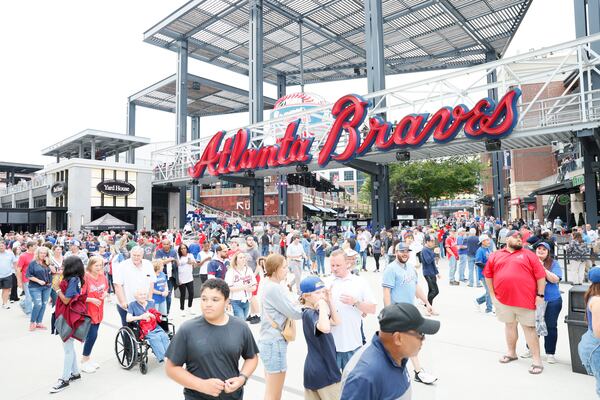 Fans walk by The Battery Atlanta toward the gates for the game between the Atlanta Braves and the Chicago Cubs at Truist Park on Wednesday, Sep. 27, 2023, in Atlanta. Bus ridesharing company Rally offers a new way to get to and from Braves games. Miguel Martinez / miguel.martinezjimenez@ajc.com