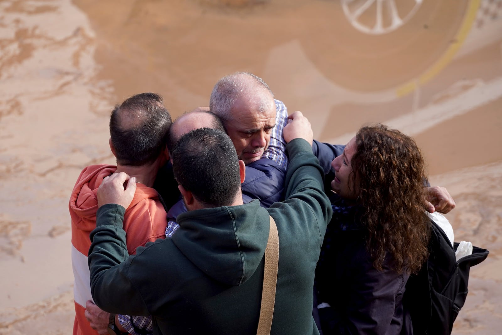 Residents react as they wait for news of their relatives trapped during the floods in Valencia, Spain, Thursday, Oct. 31, 2024. (AP Photo/Alberto Saiz)