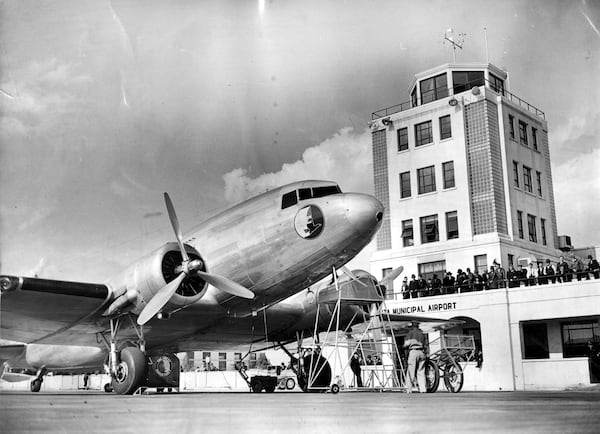 The original Dec. 24, 1939, caption for this photo reads: "Watching the silver ships arrive at Candler Field, Atlanta Municipal Airport, bringing with them the excitement of far places."