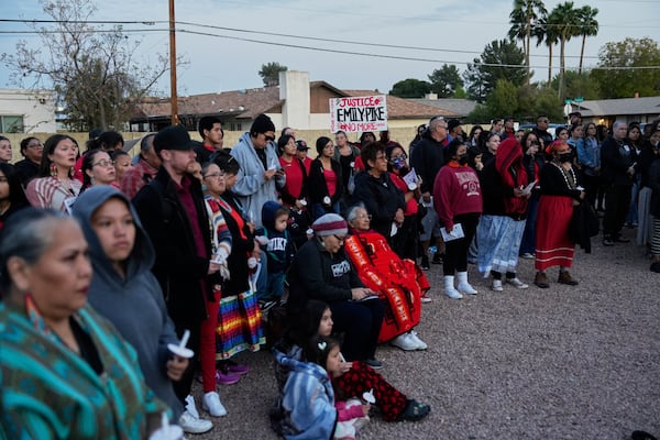 People attend a vigil for slain Native American teen Emily Pike in Mesa, Ariz., Thursday, March 6, 2025. (AP Photo/Samantha Chow)