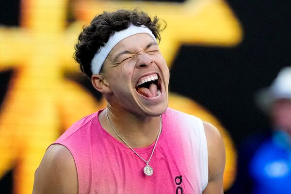 Ben Shelton of the U.S. celebrates after defeating Lorenzo Sonego of Italy in their quarterfinal match at the Australian Open tennis championship in Melbourne, Australia, Wednesday, Jan. 22, 2025. (AP Photo/Manish Swarup)