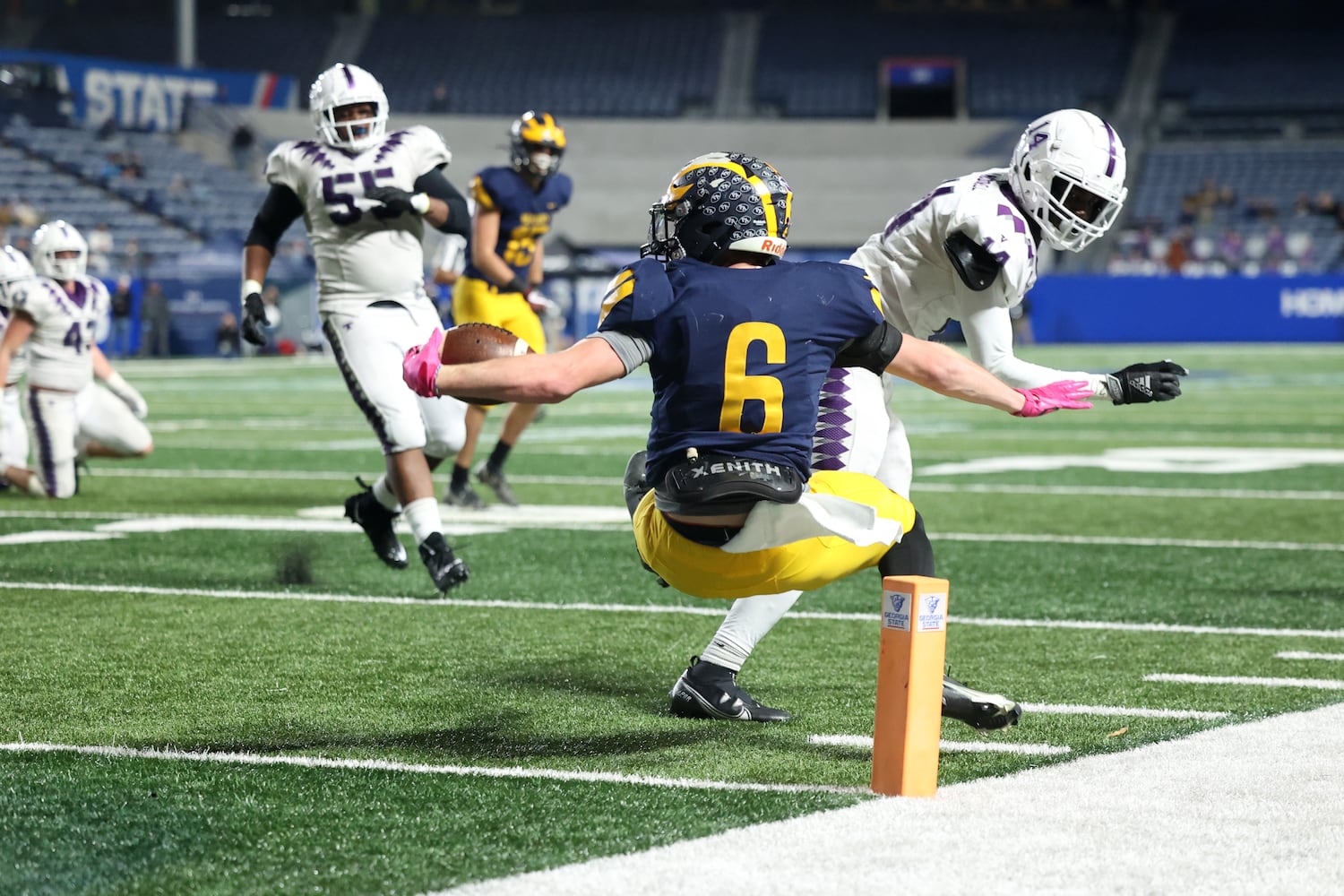 Prince Avenue Christian wide receiver Landon Owens (6) gets turned around in the air as he scores a touchdown in the second half of their 41-21 win against Trinity Christian during the Class 1A Private championship at Center Parc Stadium Monday, December 28, 2020 in Atlanta, Ga.. JASON GETZ FOR THE ATLANTA JOURNAL-CONSTITUTION