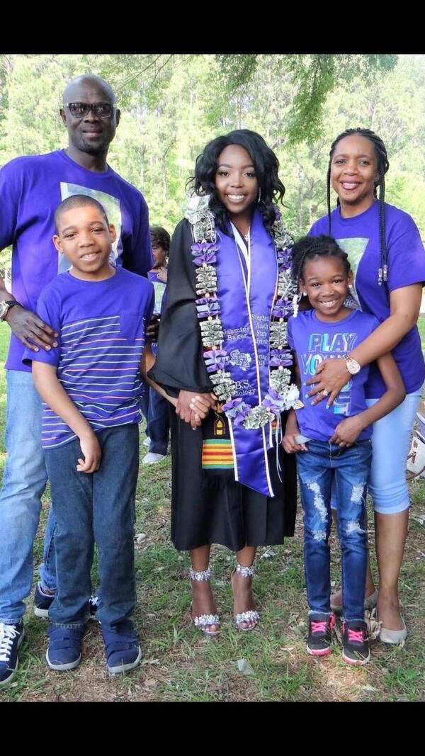 Joshua Biyoyouwei (front-left) with his father, mother and two sisters. It's hard for the teenager to take part in daily activities with his family. (Courtesy of Vera Johnson-Tokpah)