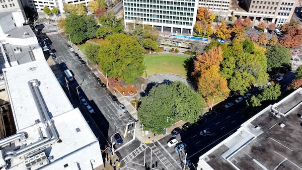 This aerial image shows the Hurt Park, located by the University campus landscape triangle on Gilmer Street, on Wednesday, November 20, 2024. Leaders at Georgia State University plan to transform a section of Gilmer Street into a vibrant green space for students. The proposal involves expanding the “Panther Quad” by closing part of Gilmer Street to vehicles and creating a dedicated area for gathering and relaxation.
(Miguel Martinez / AJC)