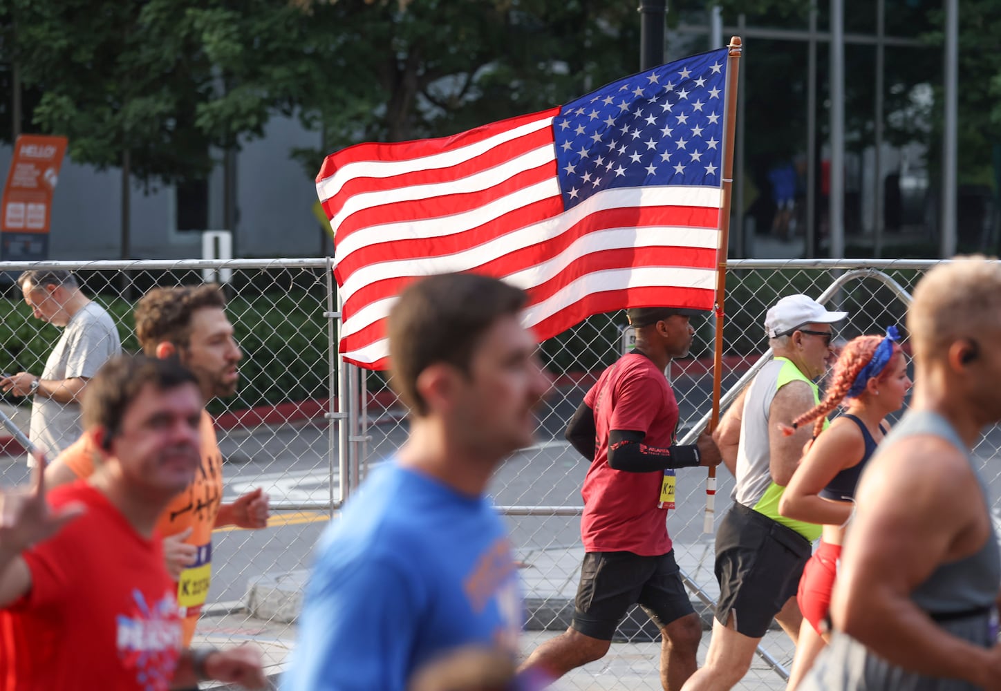 Runners take off at the start of the 53rd running of the Atlanta Journal-Constitution Peachtree Road Race in Atlanta on Monday, July 4, 2022. (Jason Getz / Jason.Getz@ajc.com)