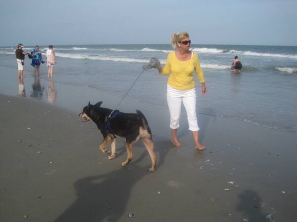 Holly Rogers with Bullet, one of her many rescue dogs. Family photo