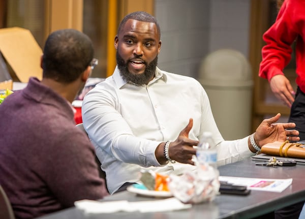 DeMario Pressley (right) attends his second board meeting at the YMCA in Cumming. The former NFL player volunteered there throughout his career and has now joined the board of the Forsyth County Family YMCA. The Y is where he was introduced to sports in middle school, and it's the place where he sought refuge from a dangerous neighborhood. PHIL SKINNER FOR THE ATLANTA JOURNAL-CONSTITUTION.