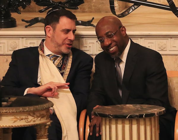 Rabbi Peter S. Berg (left) and Reverend Raphael G. Warnock (right) talk during the joint Martin Luther King Jr. Shabbat service. (Christina Matacotta / crmatacotta@gmail.com)