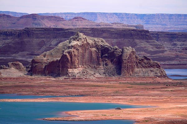 FILE - Low water levels at Wahweap Bay at Lake Powell along the Upper Colorado River Basin are pictured, June 9, 2021, at the Utah and Arizona border at Wahweap, Ariz. (AP Photo/Ross D. Franklin, File)