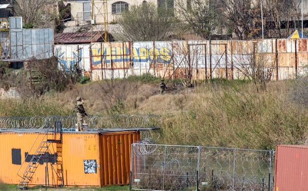 Security personal stand guard along the Texas-Mexico border in anticipation for a visit by Vice President JD Vance to the an immigration processing facility in Eagle Pass, Texas, Wednesday, March 5, 2025. (AP Photo/Rodolfo Gonzalez)