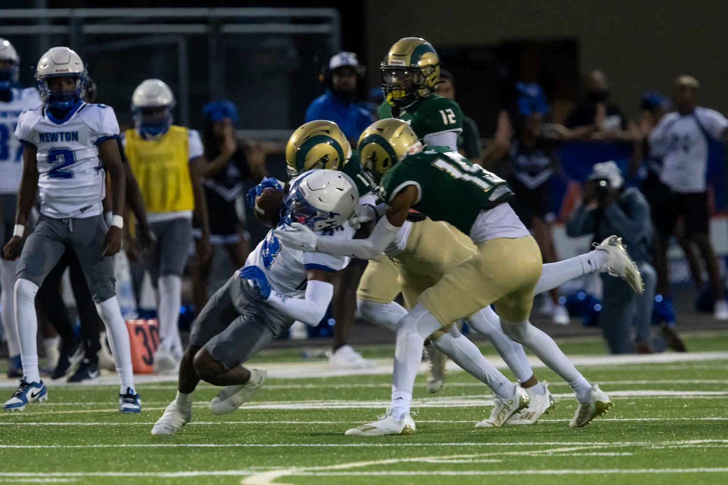 Newton County’s Marcus Calwise (3) is tackled by the Grayson defense during Friday's game. (Photo/Jenn Finch)