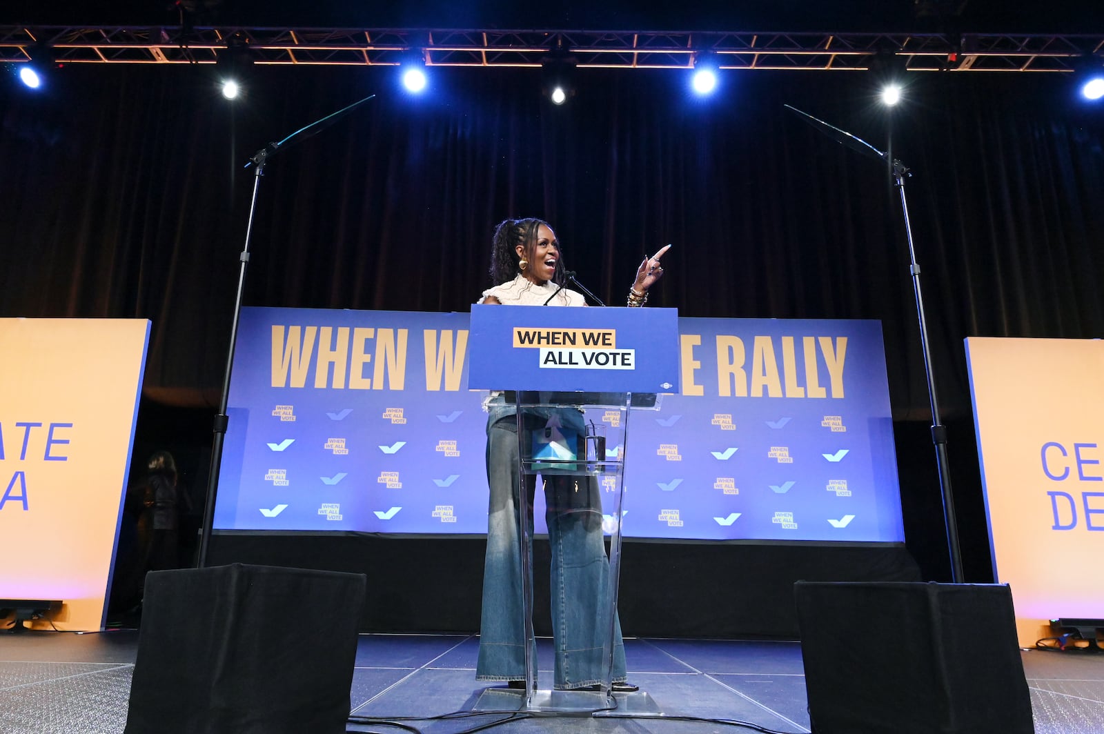 Former first lady Michelle Obama speaks Tuesday during a When We All Vote rally in College Park. The event was held close to Clayton County, one of the most reliably Democratic counties in the state — and also where turnout for early voting has lagged behind other left-leaning areas. Hyosub Shin/AJC