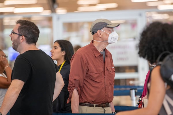 With the surge in COVID numbers, some travelers are masking up at Hartsfield-Jackson Atlanta International Airport in Atlanta on Friday, August 4, 2023. (Katelyn Myrick/katelyn.myrick@ajc.com)