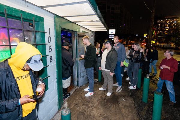 People wait to enter Northside Tavern. This year the bar celebrates its 50th anniversary.(Arvin Temkar / arvin.temkar@ajc.com)