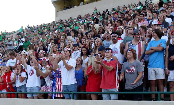 Buford High School football fans cheer in the stadium during Buford’s game against Jonesboro High School. Jenna Eason / Jenna.Eason@coxinc.com