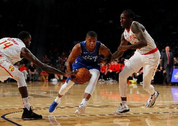  Mavs guard Dennis Smith Jr. took advantage of some lackluster Hawks defense. (Kevin C. Cox/Getty Images)