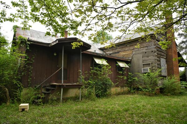 Exterior of Knox Cabin, a Duluth cabin that's at least 191 years old, on Wednesday, April 14, 2021. It's possibly the oldest dovetail cabin in Gwinnett County, and it could be torn down to make way for a residential subdivision. The Duluth Historical Society is trying to collect donations from the community to move it to a new location. (Hyosub Shin / Hyosub.Shin@ajc.com)