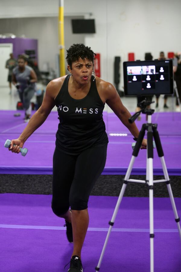 LaTasha Lewis, owner of Tadda’s Fitness in Decatur, Georgia, works out with clients during a Zoom workout at her fitness studio on Thursday, June 11, 2020. Rebecca Wright FOR THE ATLANTA JOURNAL-CONSTITUTION