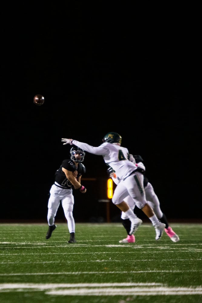 Ben Guthrie, quarterback for Alpharetta, passes the ball during the Alpharetta vs. Blessed Trinity high school football game on Friday, October 28, 2022, at Alpharetta high school in Alpharetta, Georgia. Alpharetta led Blessed Trinity 21-7 at the end of the first half.