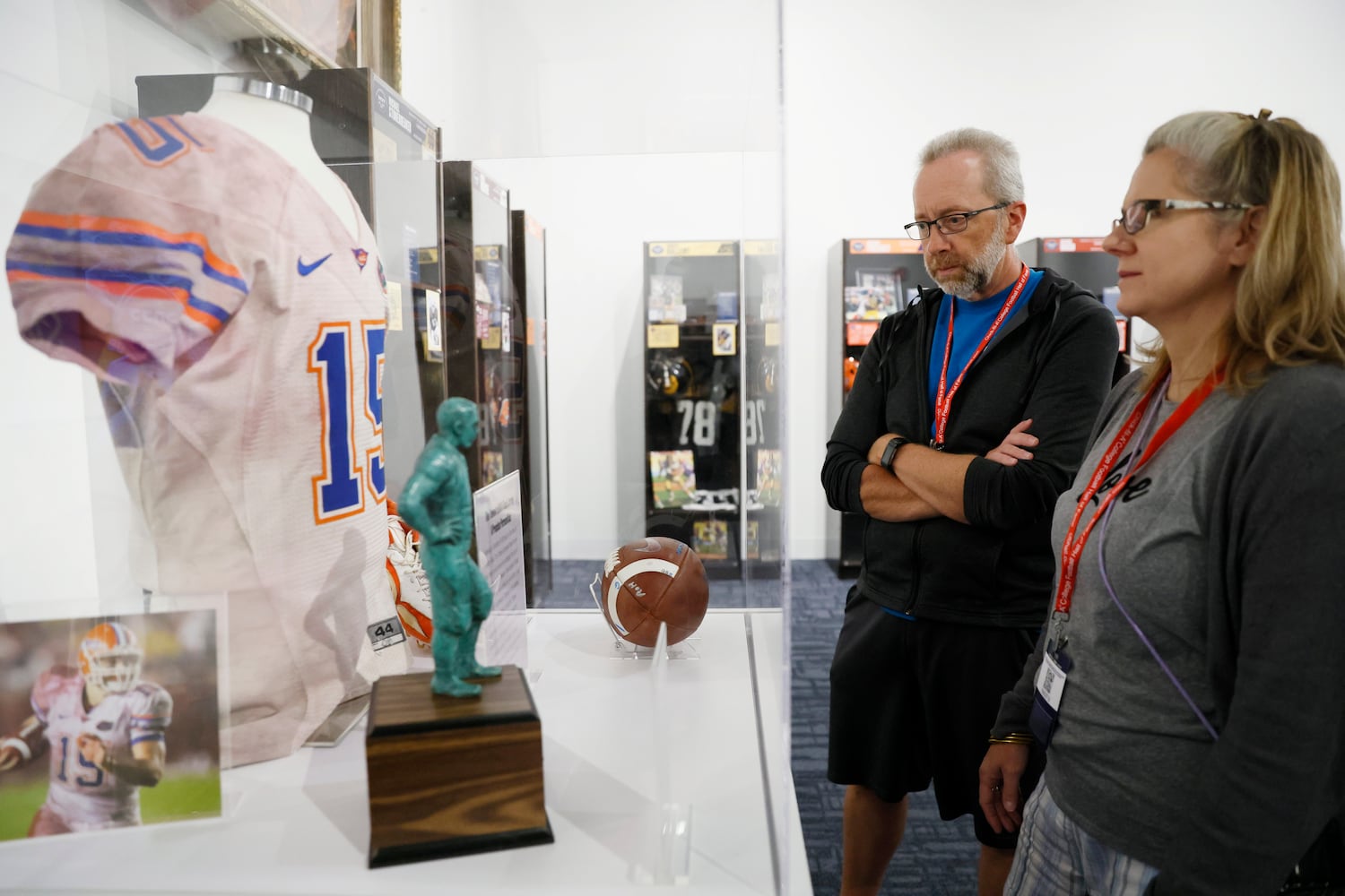 College Football Hall of Fame visitors Wayne and Denise Paxton from Harrisburg, PA, observe a Tim Tebow display at the new limited-run locker installation honoring the 22 members of the 2023 Hall of Fame class on Thursday, Sept. 28, 2023, in Atlanta.
Miguel Martinez /miguel.martinezjimenez@ajc.com