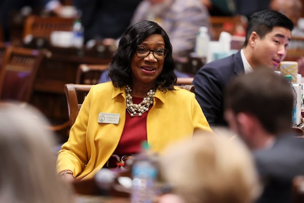 House minority leader Carolyn Hugley, D-Columbus, speaks with other members of the House of Representative during day two of the legislative session at the State Capitol, Tuesday, Jan. 14, 2025, in Atlanta. (Jason Getz / AJC)