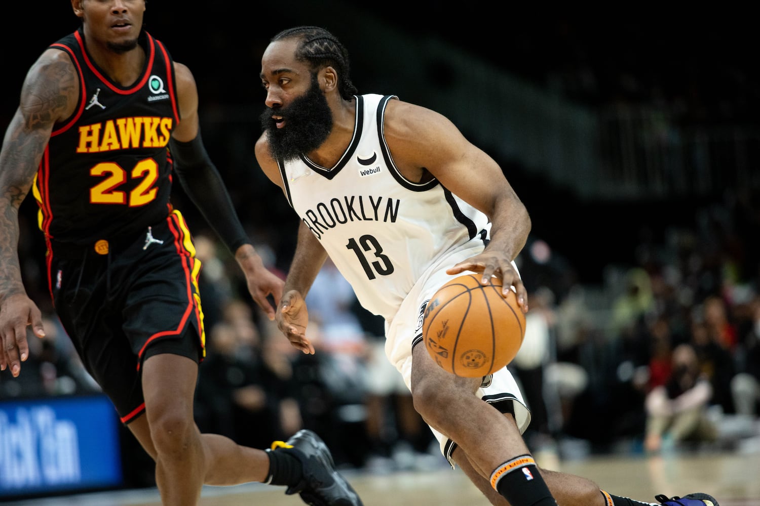 The Nets' James Harden (7) dribbles the ball during a game between the Atlanta Hawks and the Brooklyn Nets at State Farm Arena in Atlanta, GA., on Friday, December 10, 2021. (Photo/ Jenn Finch)