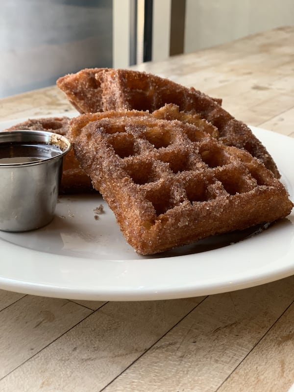 West Egg Cafe’s Churro Waffles with Warm Chocolate Sauce. (Courtesy of West Egg Cafe)