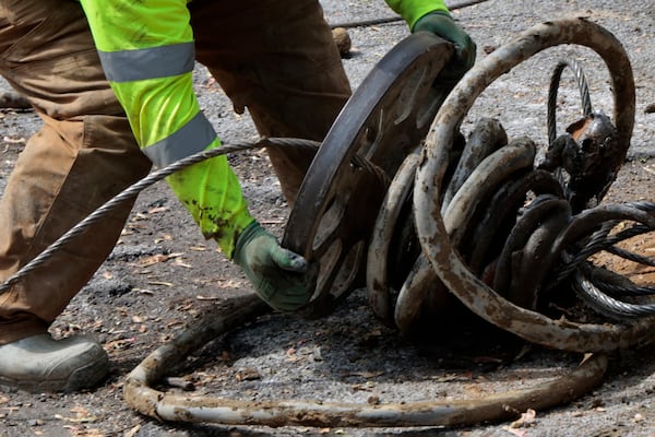 Discarded lead pipe is removed from a home on the 10100 block of South Green Street in Chicago on May 2, 2024. (Antonio Perez/Chicago Tribune/TNS)