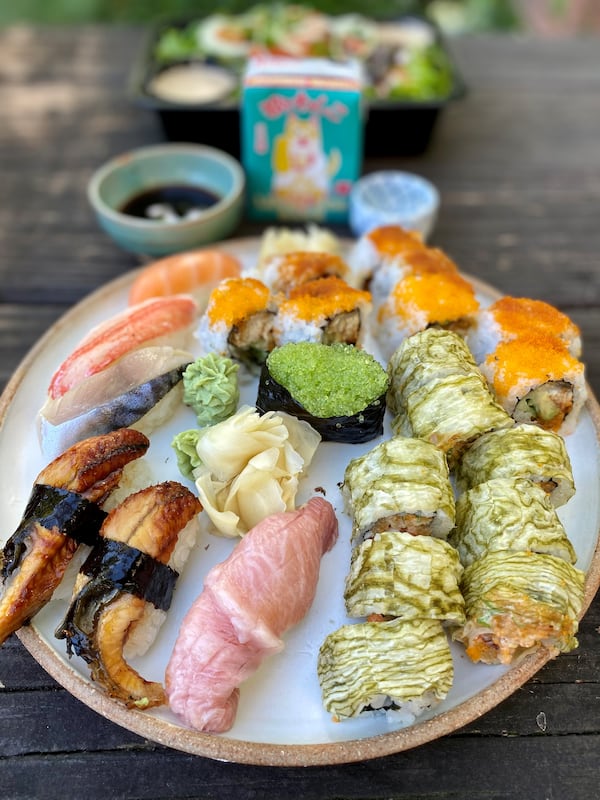 Nakato Japanese Restaurant allows you to bring a first-rate sushi experience to your home. Shown here are a selection of nigiri; the white kelp roll and the rock and roll. (Wendell Brock for The Atlanta Journal-Constitution)